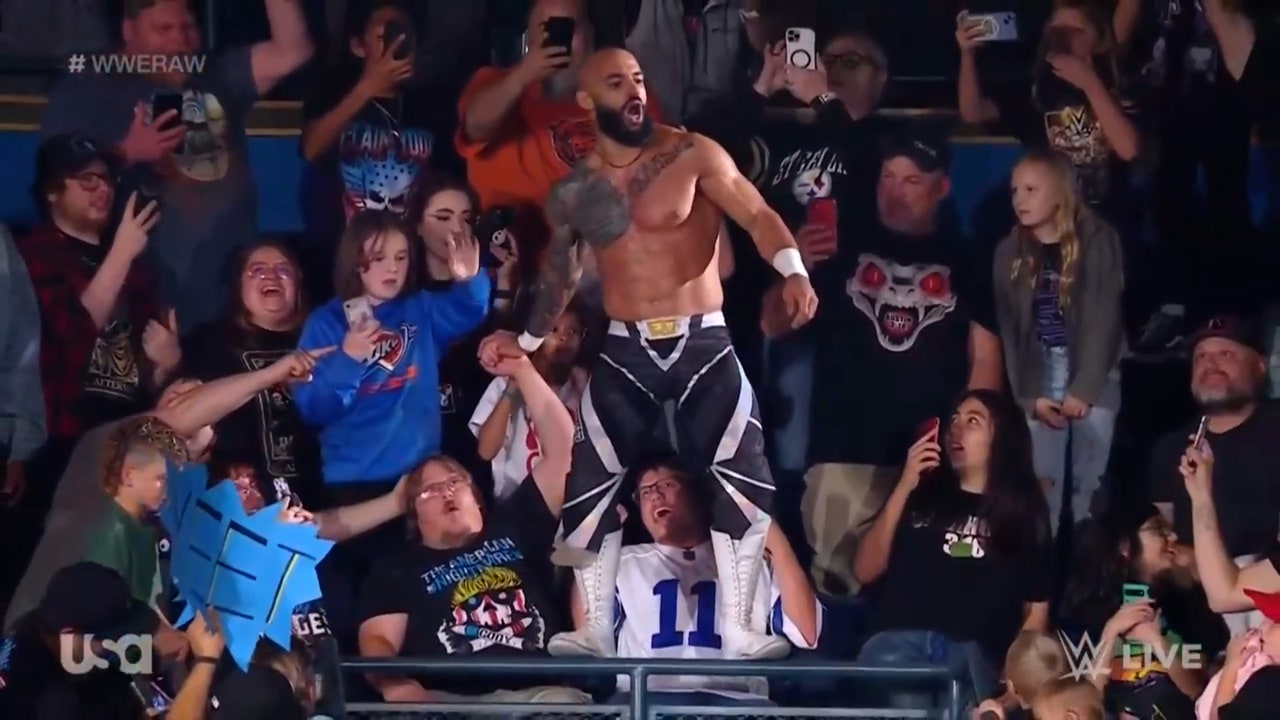 Ricochet launches from the balcony in Falls Count Anywhere Match vs. Shinsuke Nakamura