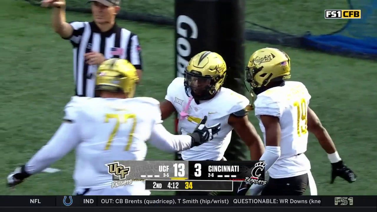 UCF's RJ Harvey rushes for a 13-yard touchdown to extend the lead against Cincinnati
