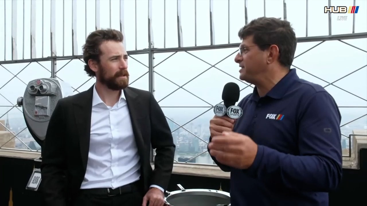 Ryan Blaney talks with Bob Pockrass on top of the Empire State Building after winning the 2023 NASCAR Cup Title