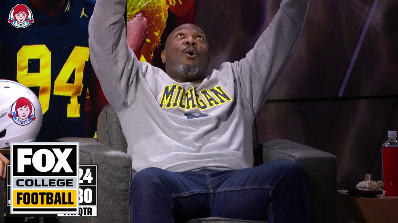 Beanie Wells reacts to Rod Moore picking off Ohio State’s Kyle McCord, to seal Michigan's victory