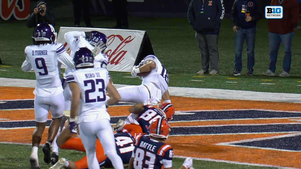 Garner Wallace scoops-and-scores a fumble forced by Braydon Brus to give Northwestern a 42-31 lead over Illinois