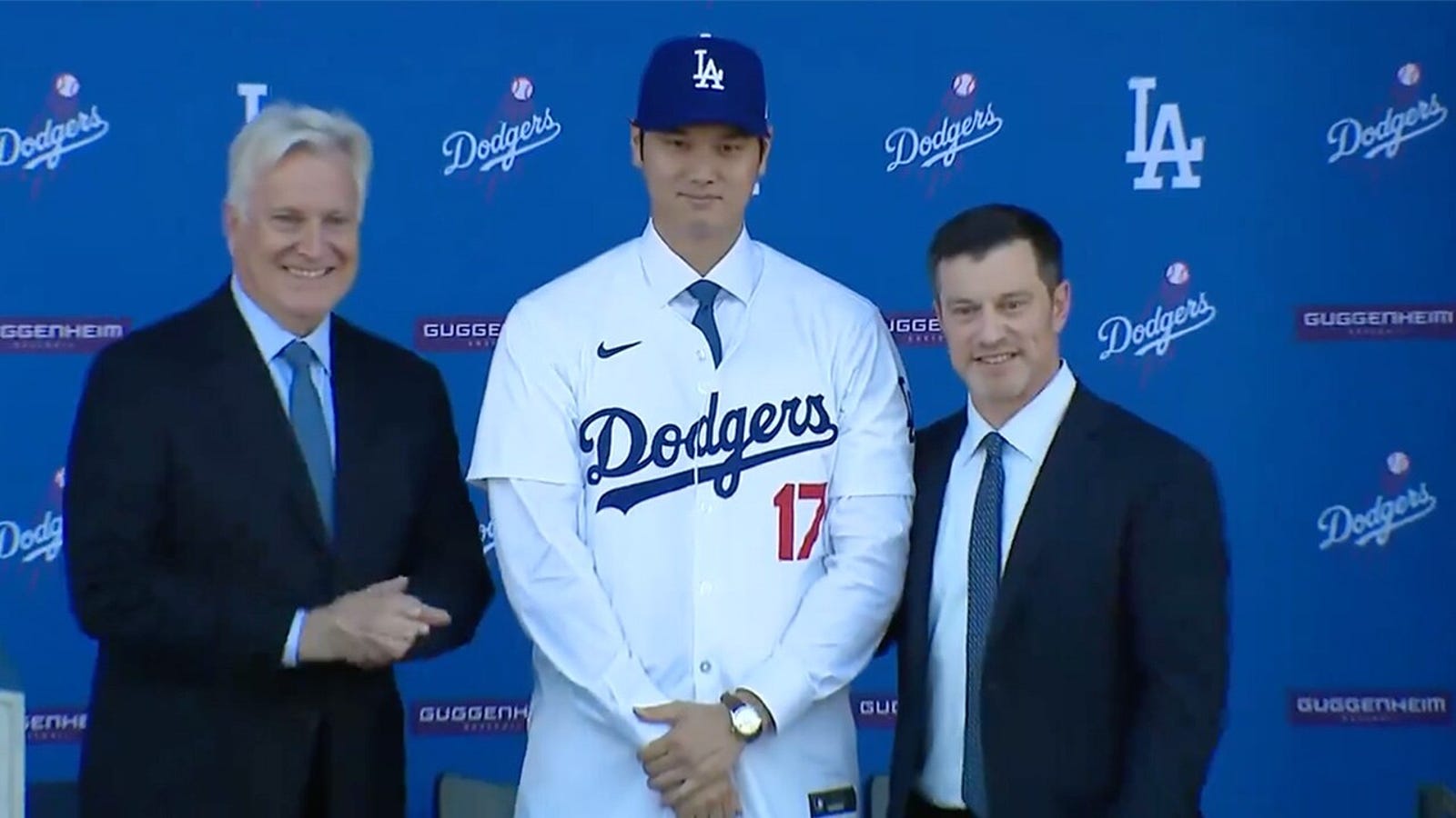 Ohtani puts on Dodgers jersey for first time at introductory conference