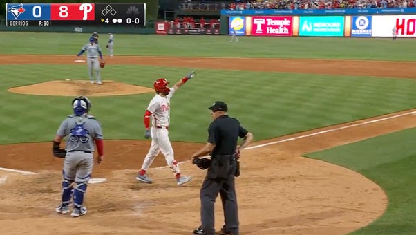 Bryce Harper smashes a grand slam, extending the Phillies' lead over the Blue Jays