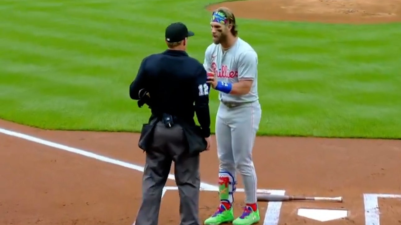 Phillies' Bryce Harper gets thrown out during the first inning of matchup against Rockies