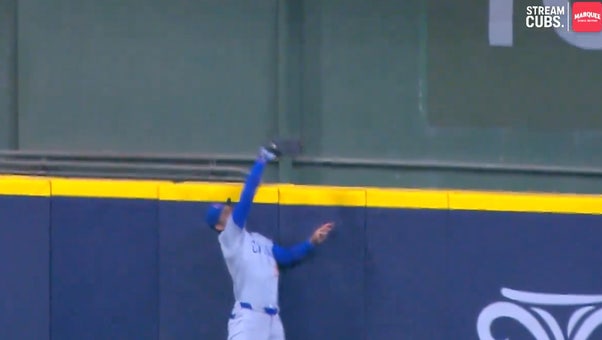 Cubs' Cody Bellinger leaps and robs Brewers' Willy Adames of a home run