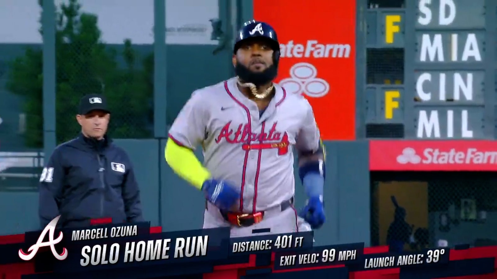 Braves' Marcell Ozuna sends his 35th homer of the year to deep left field, breaking the tie against the Rockies