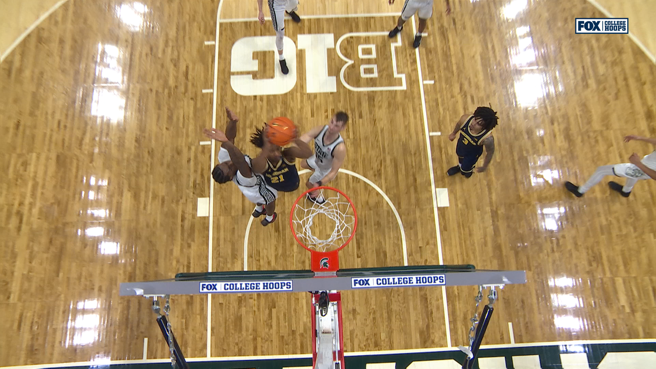 Michigan’s Elliot Cadeau feeds Morez Johnson Jr. for layup to seal win over Michigan State