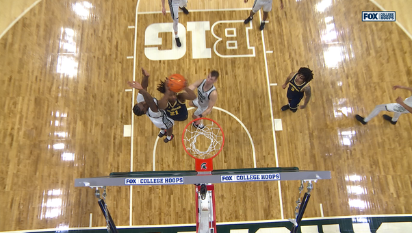 Michigan’s Elliot Cadeau feeds Morez Johnson Jr. for layup to seal win over Michigan State