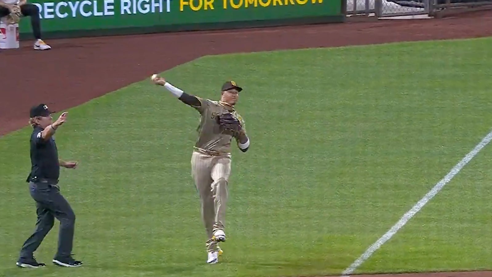 Padres' Manny Machado flashes the leather and makes stellar throw from foul territory to record the out