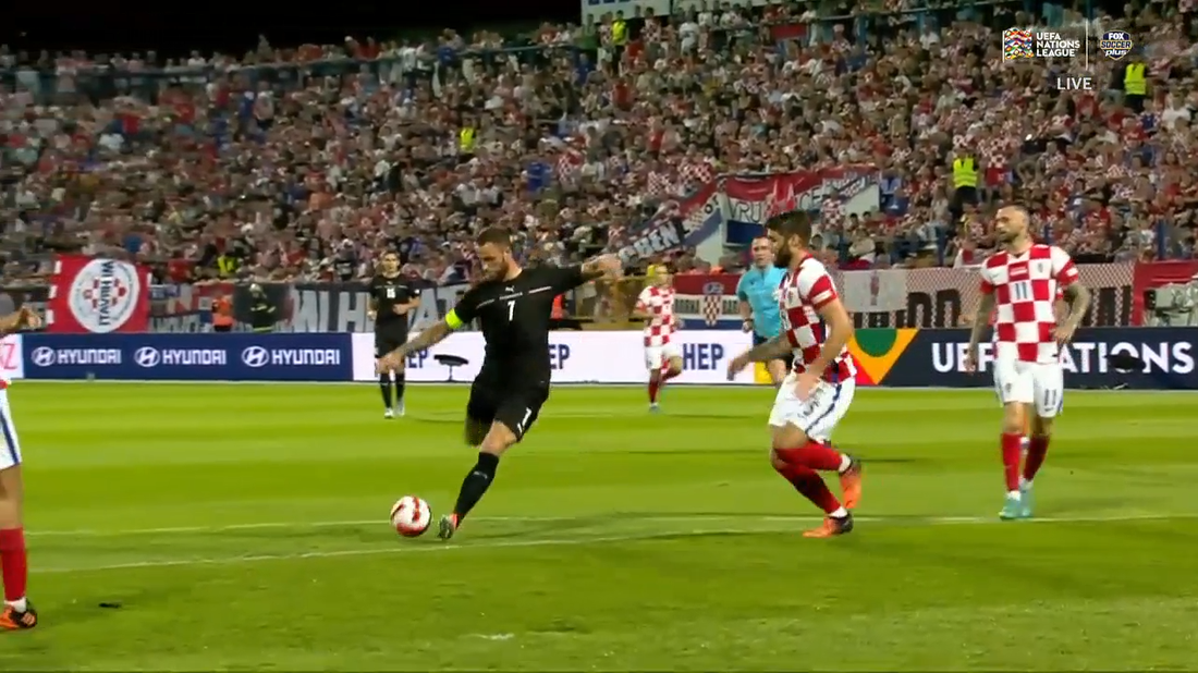 Marko Arnautovic weaves past defenders to give Austria a 1-0 lead over Croatia