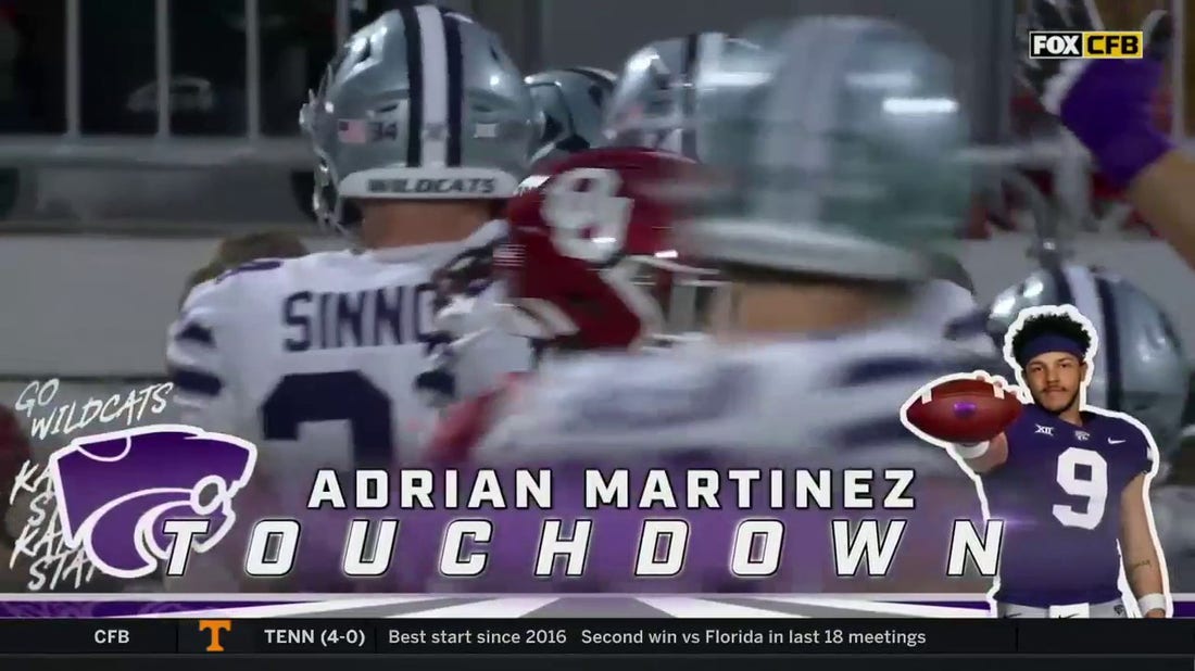 Kansas State's Adrian Martinez fakes the handoff and rushes for a six-yard touchdown