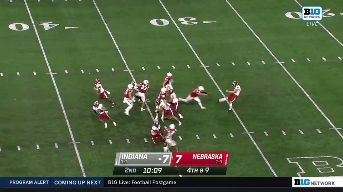 Nebraska's Chris Kolarevic blocks the punt to set up Malcolm Hartzog's scoop and score