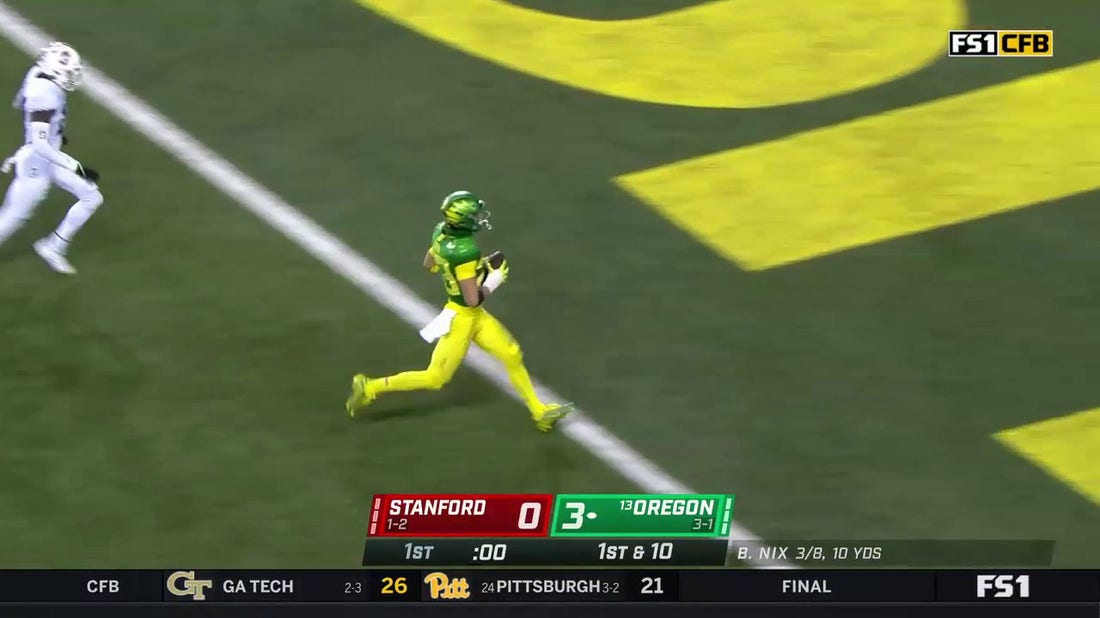 Oregon's Chase Cota takes the short pass 49 yards to the house for a touchdown
