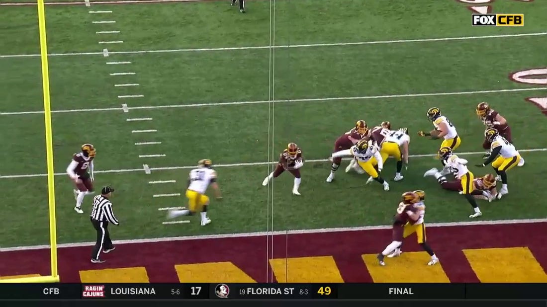 Mohamed Ibrahim bursts into the end zone to score a five-yard rushing TD for Minnesota