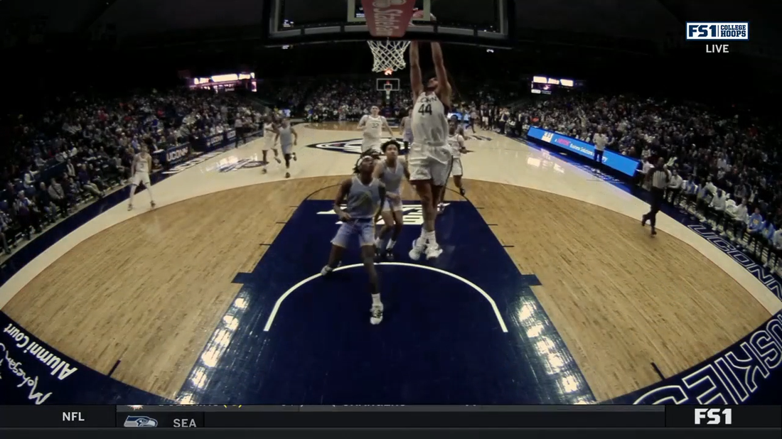 UConn's Andre Jackson gets the steal, and goes behind the back for the fast-break dunk