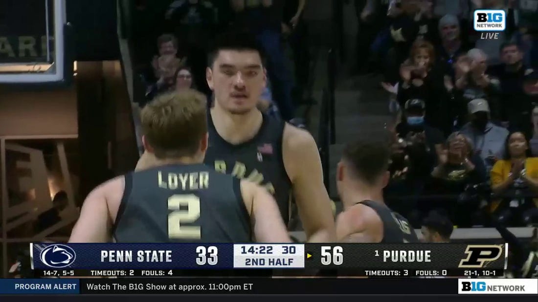 Zach Edey hammers home a vicious alley-oop dunk to extend Purdue's lead