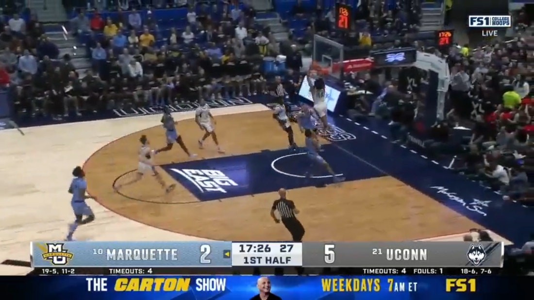 UConn's Andre Jackson Jr. throws down a powerful dunk early over Marquette