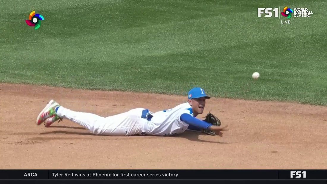 Nicky Lopez dives and starts a 6-4-3 double play for Italy vs. Panama