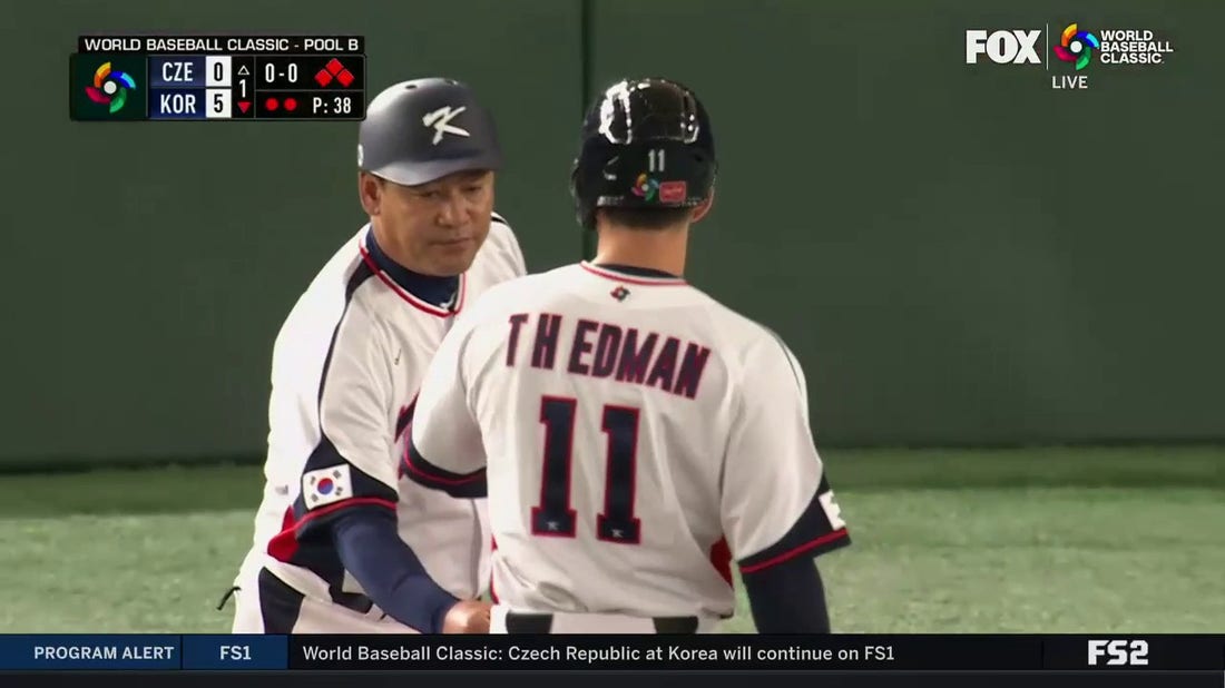 Korea's Tommy Edman crushes a two-out, 2 RBI single to center field extending the lead 5-0