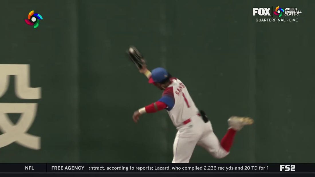 Cuba's Roel Santos makes a great catch in left field to rob Australia of extra bases