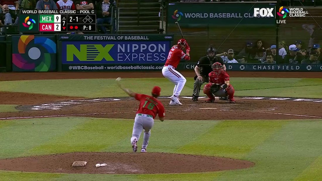 Edouard Julien slams a home run to right center field for Canada against Mexico