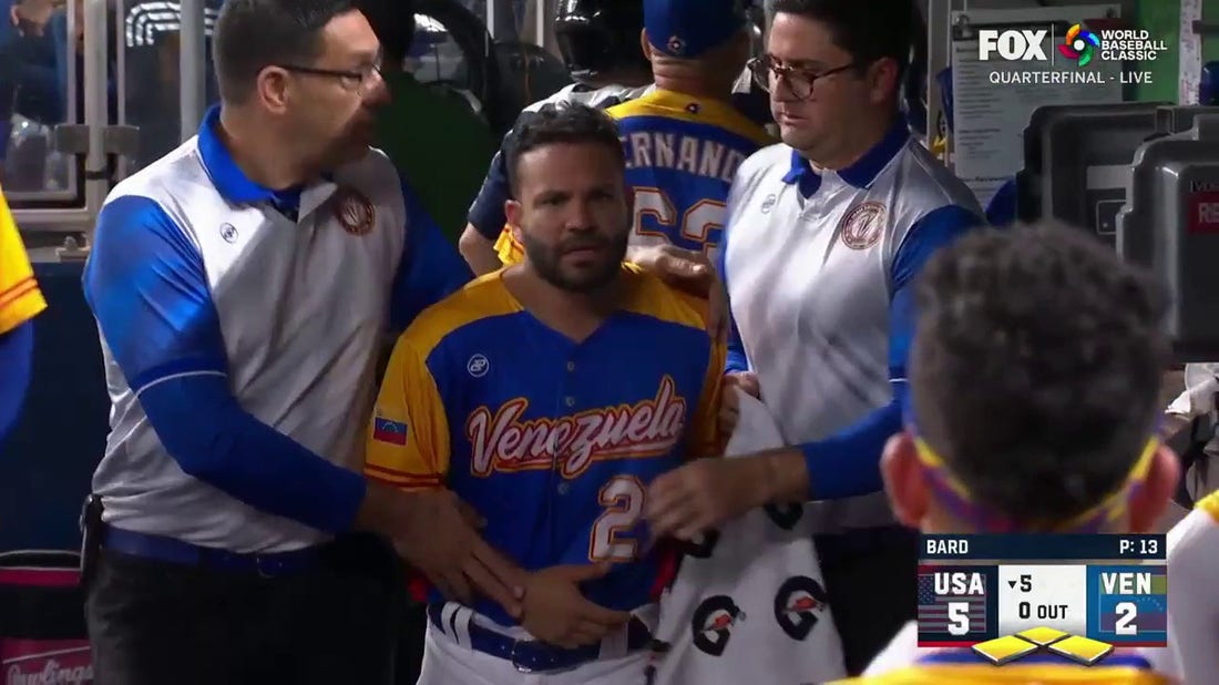 Venezuela's Jose Altuve is drilled with a pitch and comes out of the game vs. the USA