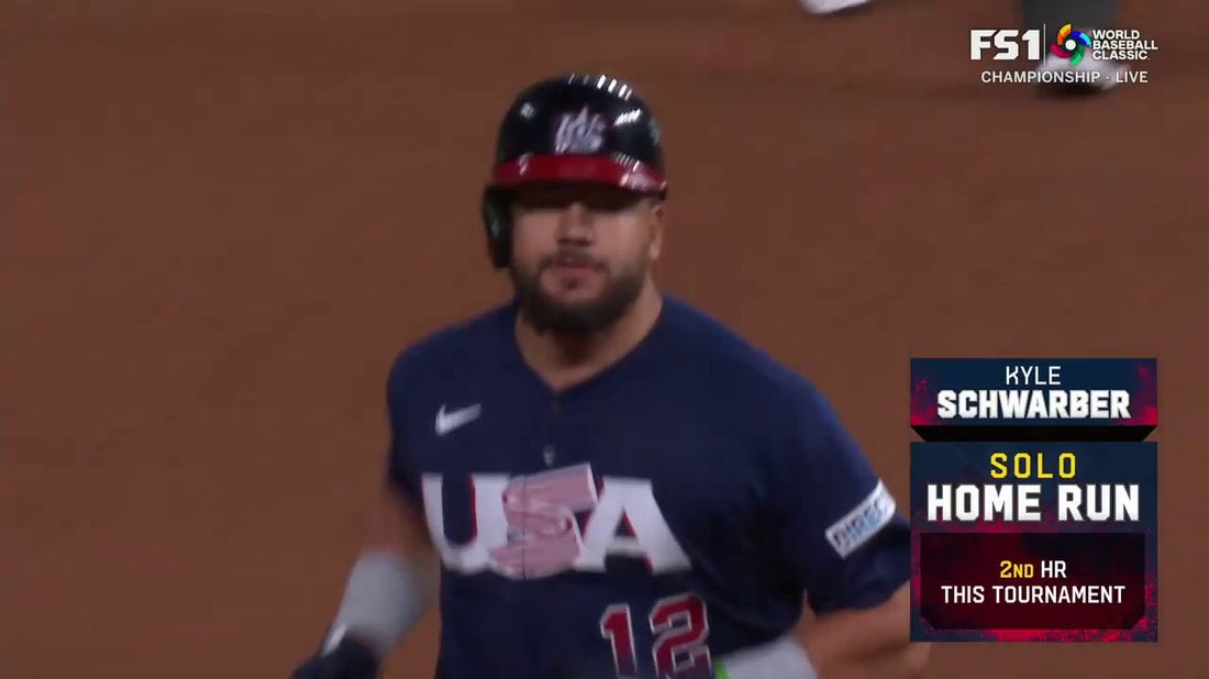 Kyle Schwarber launches a solo home run to right, helping Team USA trim into Japan's lead