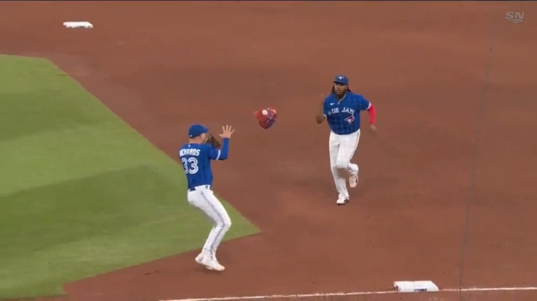 Vladimir Guerrero Jr. gets a grounder stuck in his glove and tosses the mitt with the ball to get the out at first