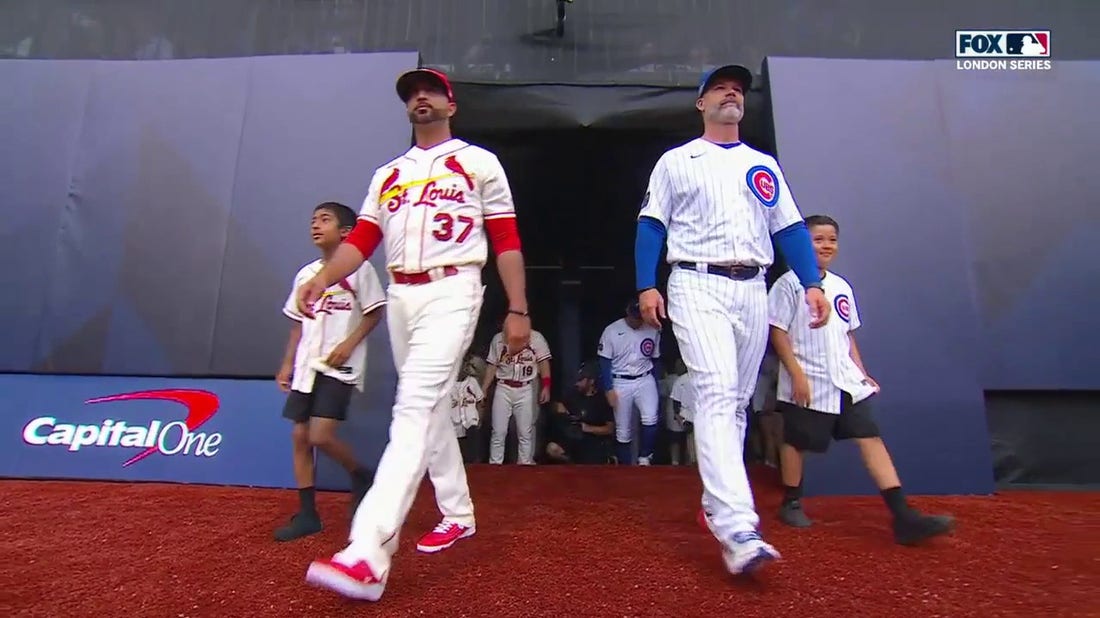 Chicago Cubs and the St. Louis Cardinals walk out into London Stadium