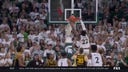 Michigan State's Mady Sissoko rattles the rim with a two-handed jam to even the score against Iowa