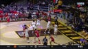Fresno State's Isaih Moore makes a two-handed dunk over a Wyoming defender