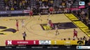 Keisei Tominaga hits a 3-pointer from almost half-court to extend Nebraska's lead over Iowa