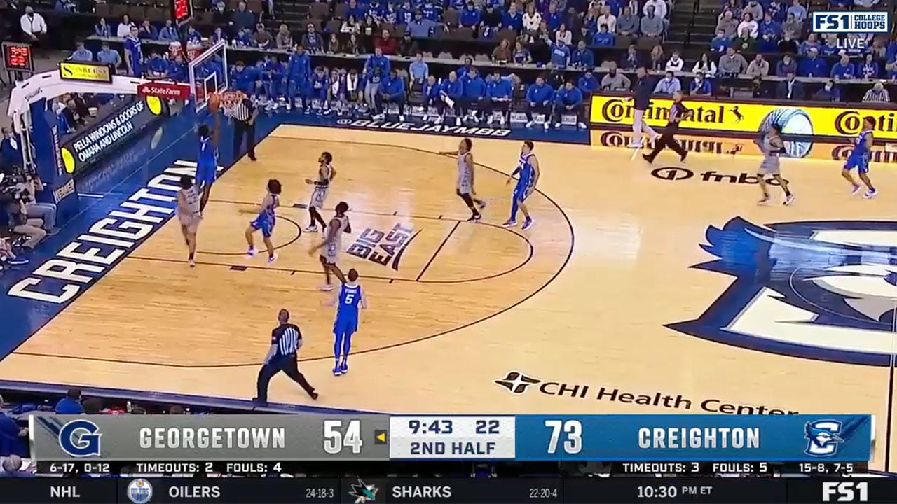 Creighton's KeyShawn Feazell slams home the alley-oop to pad the BlueJays' lead over Georgetown