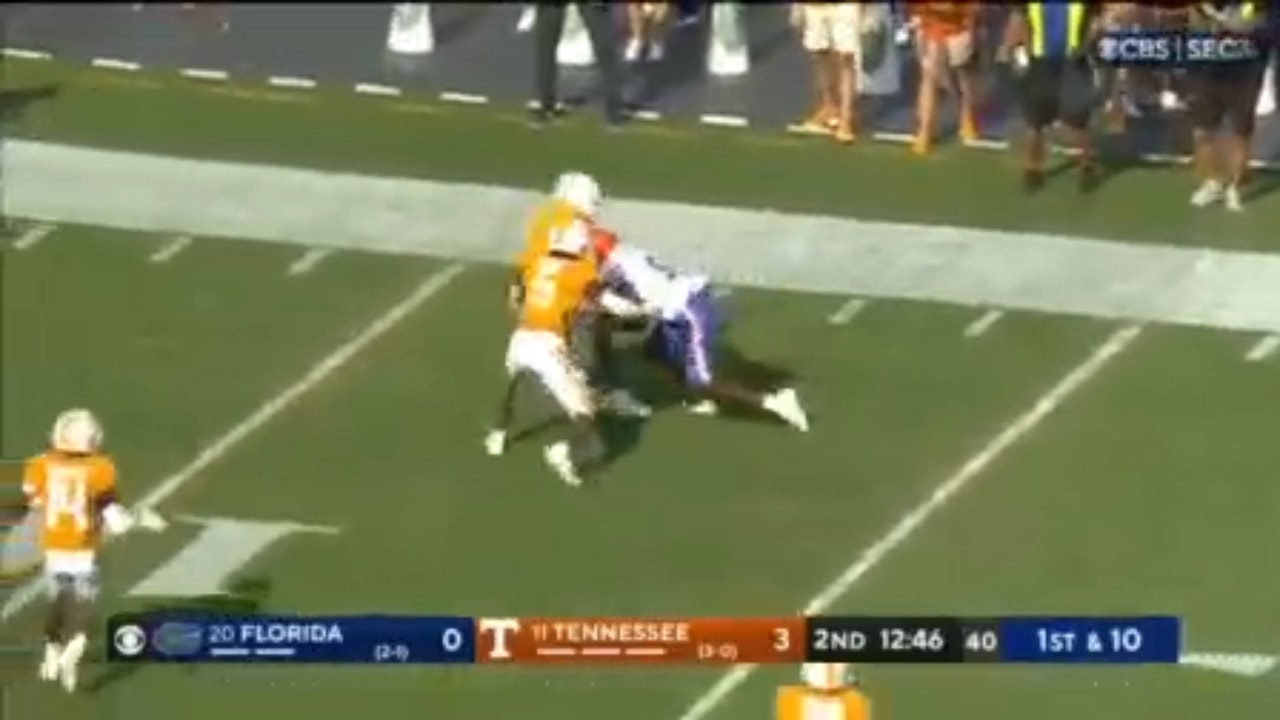 Florida's Keon Zipperer crashes through defenders for a 44-yard receiving touchdown