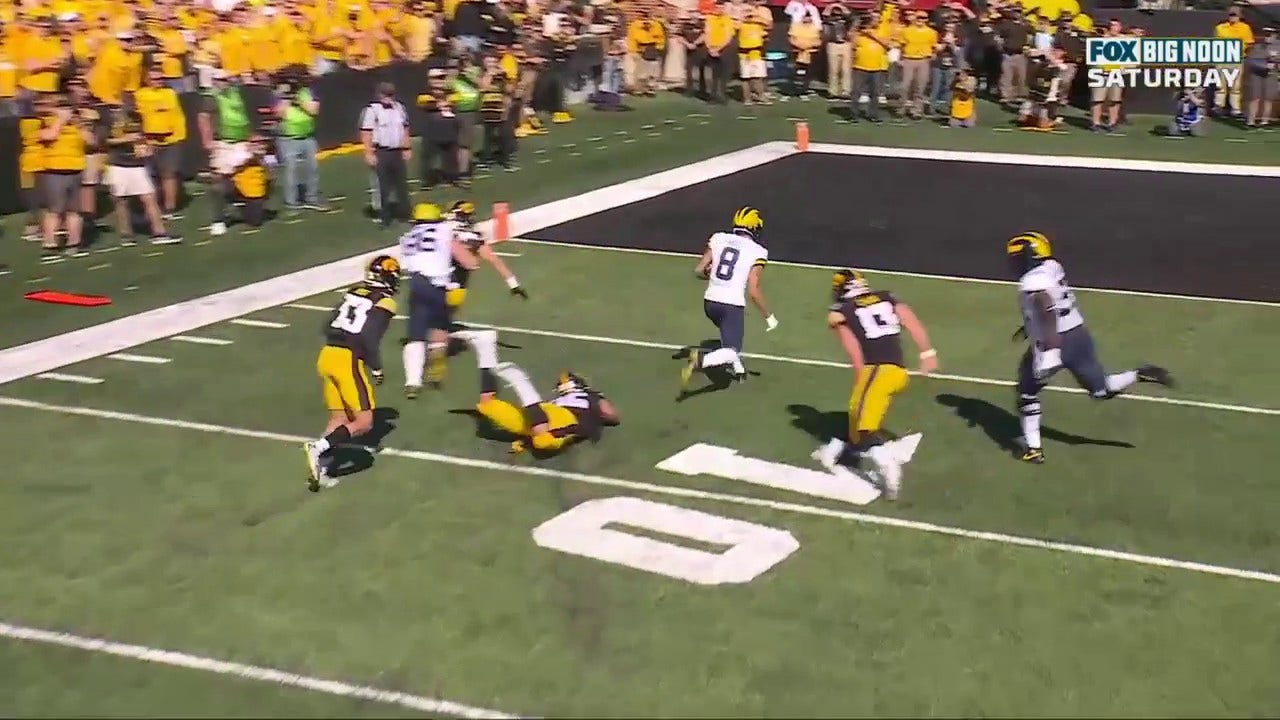 Ronnie Bell finishes an impressive opening drive for the Wolverines to take an early 7-0 lead over Iowa