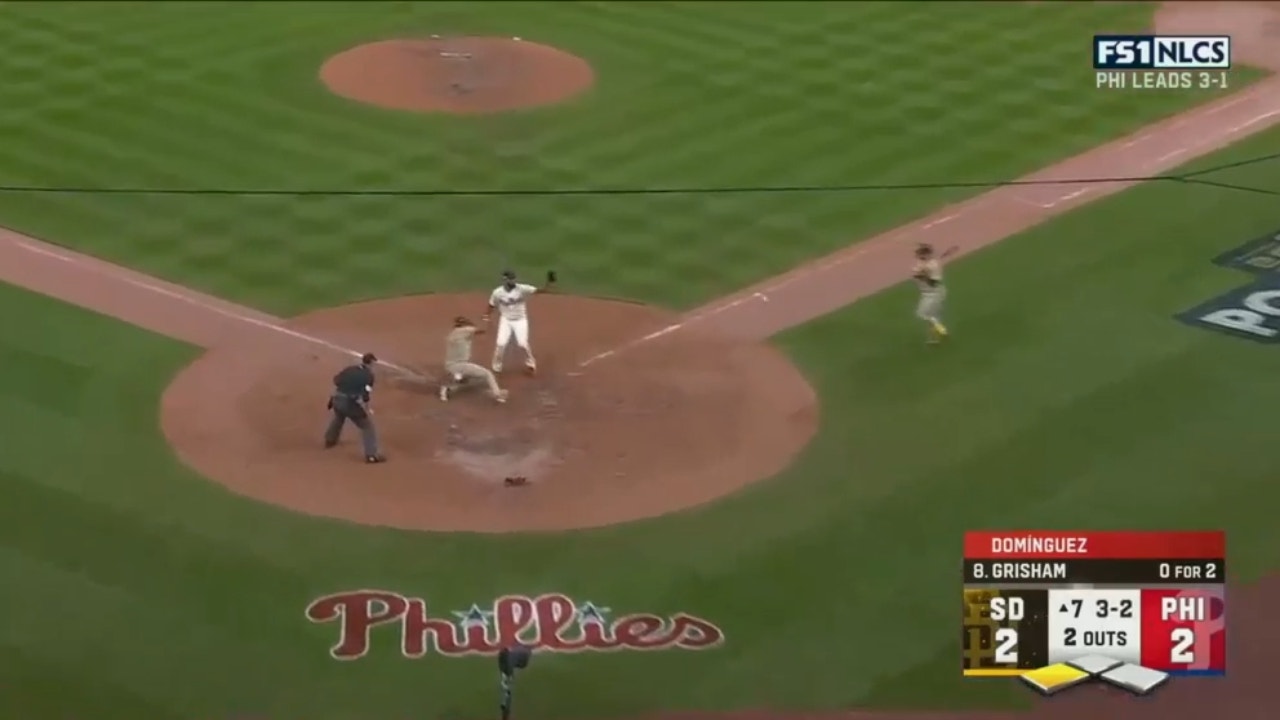 Padres' Jose Azocar scores the go-ahead run on a wild pitch