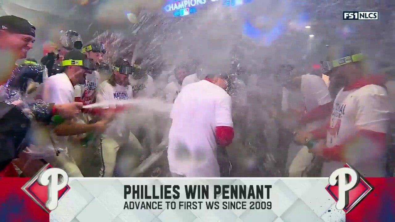 The Phillies pop some champagne and celebrate heading to the World Series for first time since 2009