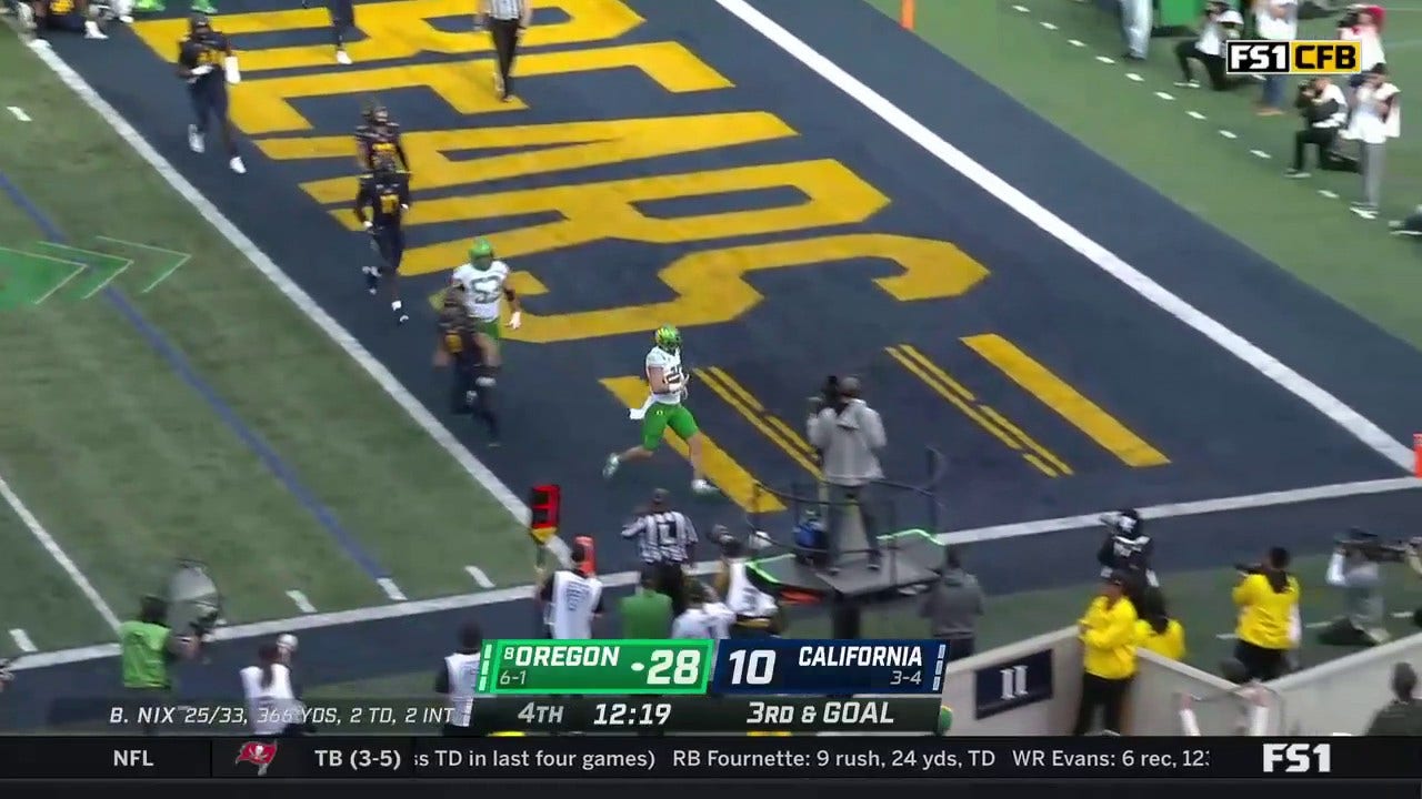 Bo Nix punches in a two-yard rushing touchdown extending the Oregon lead to 35-10