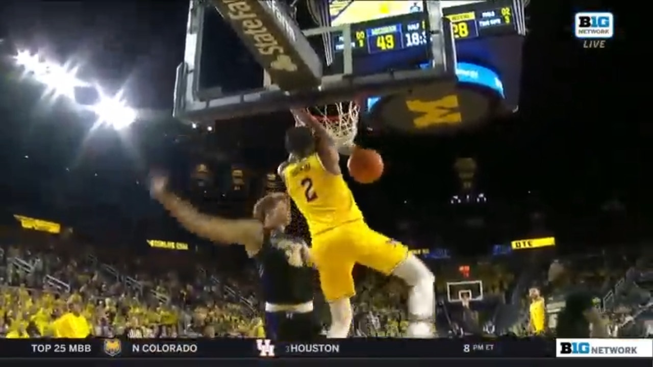 Kobe Bufkin slams the two-handed dunk for Michigan against Purdue Fort Wayne