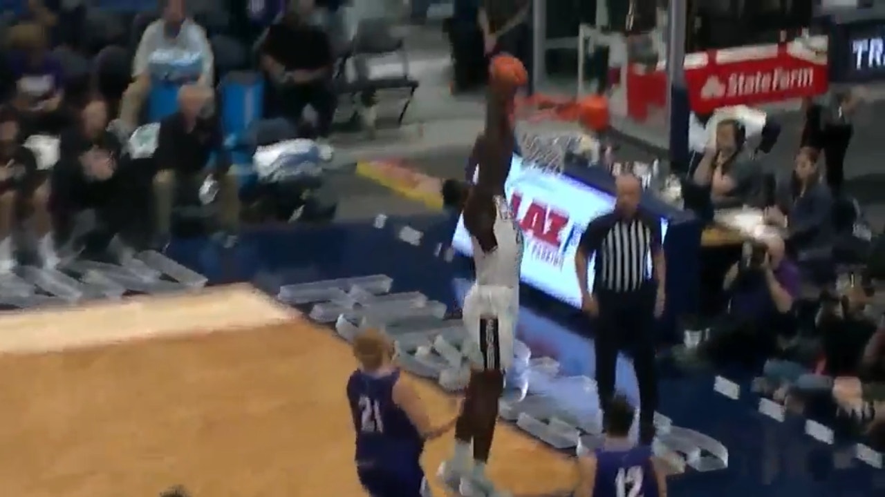 Adama Sanogo and Tristen Newton run a pick-and-roll to gain an early lead for Uconn