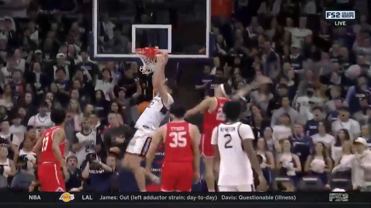 UConn's Donovan Clingan throws down the jam to extend their early lead against Boston U