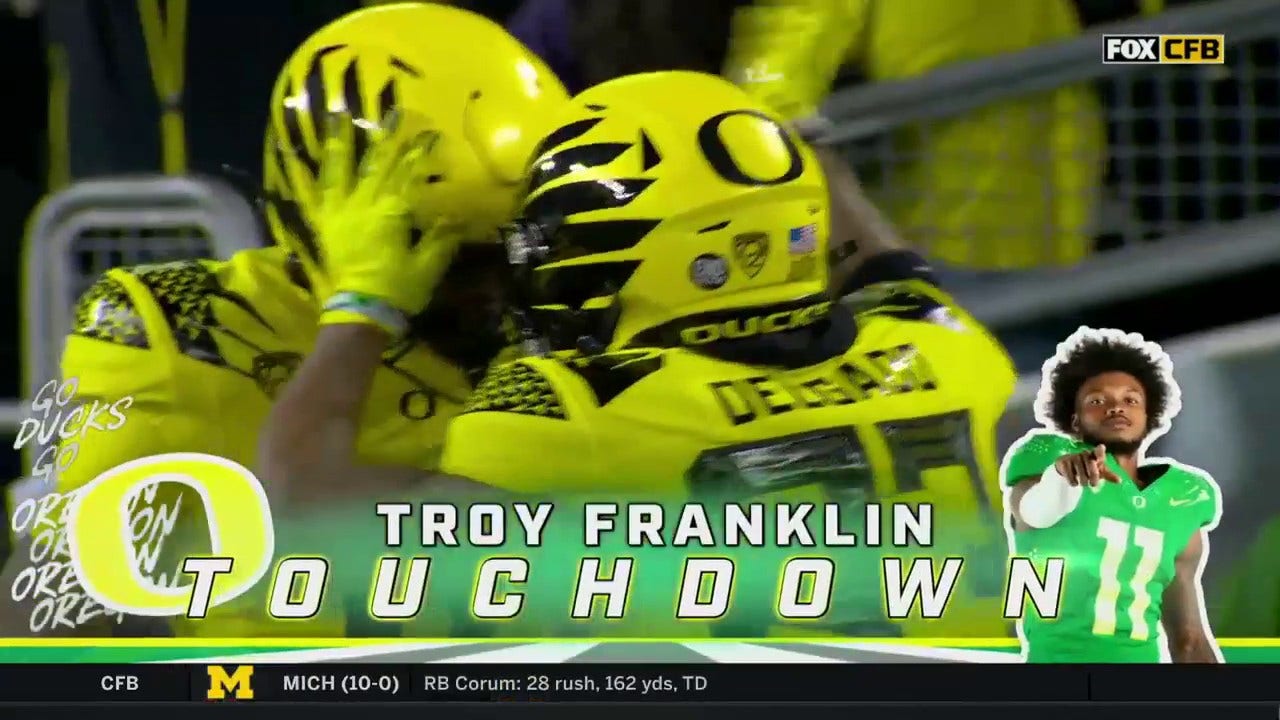 Oregon's Troy Franklin catches a 48-yard TD pass from Bo Nix to give the Ducks a 31-27 lead