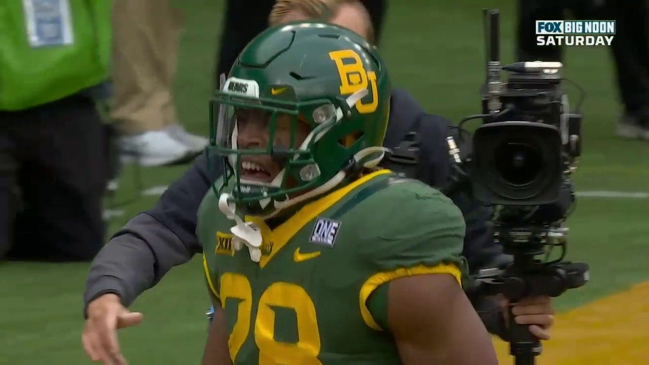Qualan Jones bursts past TCU's defense for a 10-yard rushing TD to give Baylor the early lead