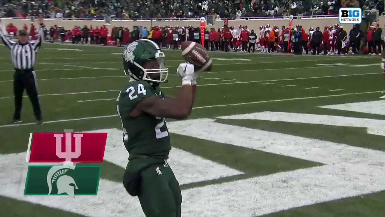 Elijah Collins finds a hole to extend the Michigan State lead