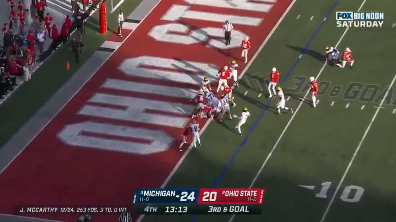 Michigan's J.J. McCarthy rushes in a 3 yard touchdown