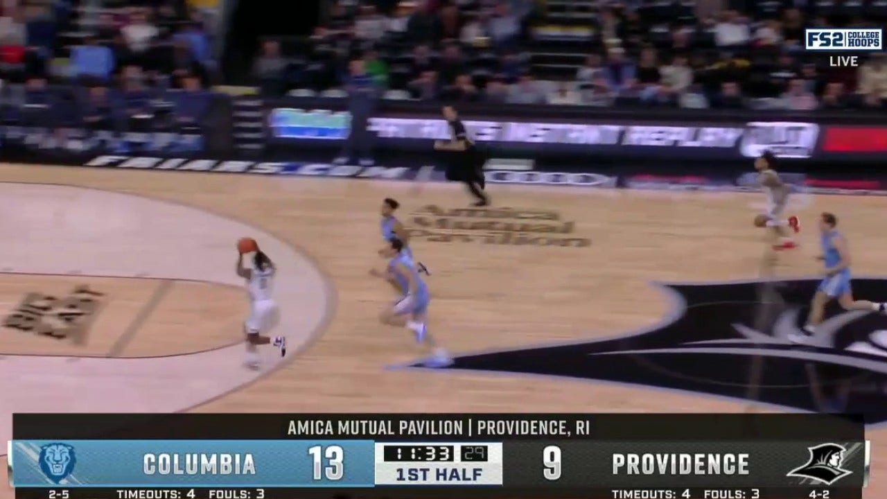 Providence's Rafael Castro throws football pass to other end to Jayden Pierre for the two-handed dunk vs. Columbia