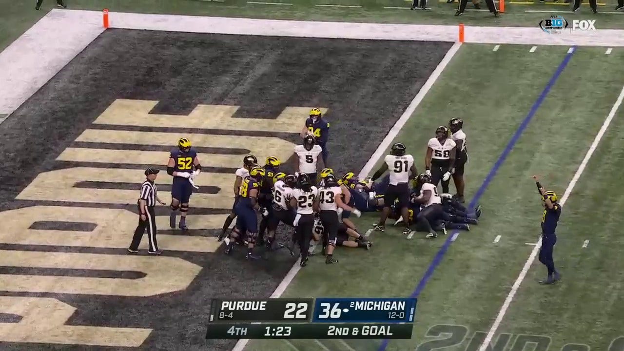 Michigan's Kalel Mullings runs in a three-yard TD to solidify a 43-22 victory over Purdue