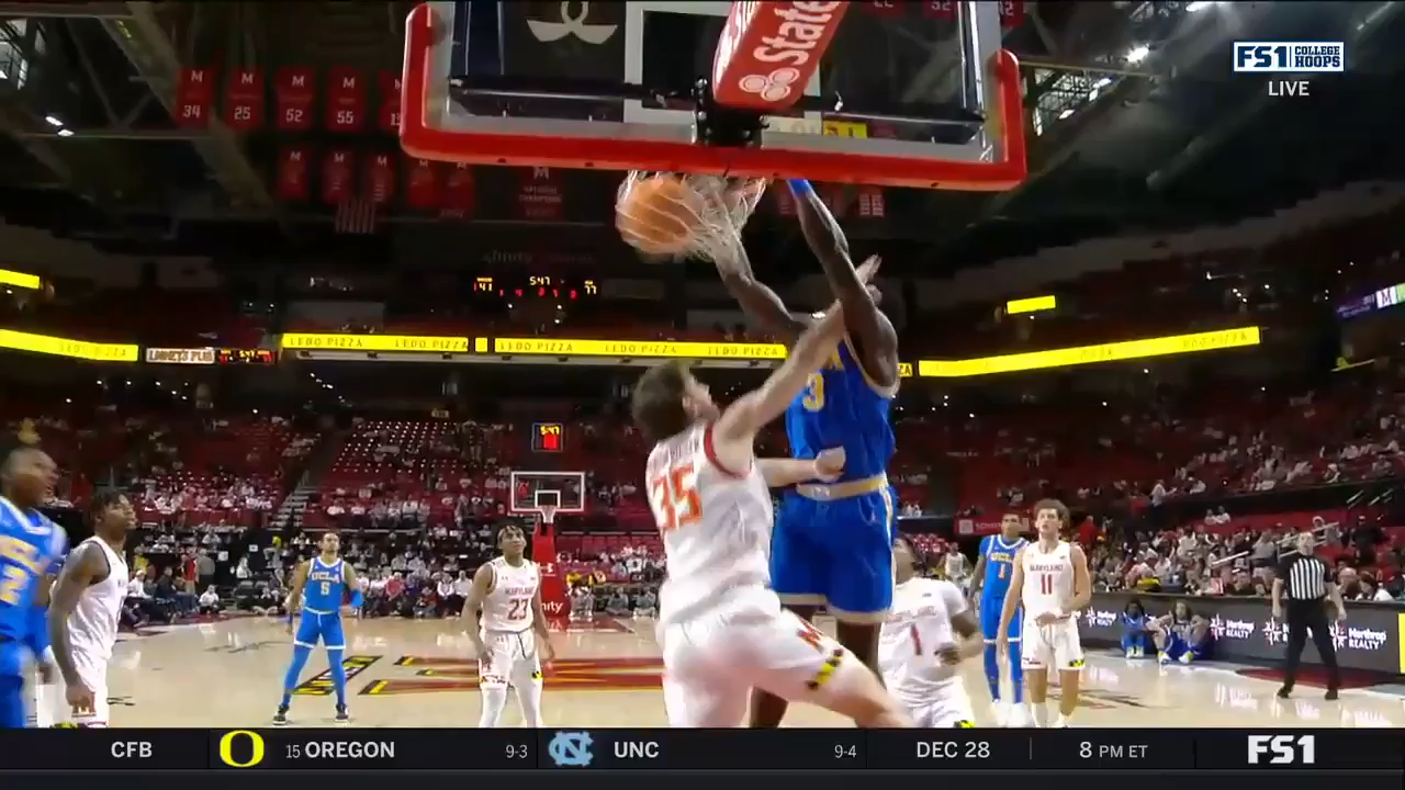 UCLA big man Adem Bona posterizes a Maryland defender in a blowout win