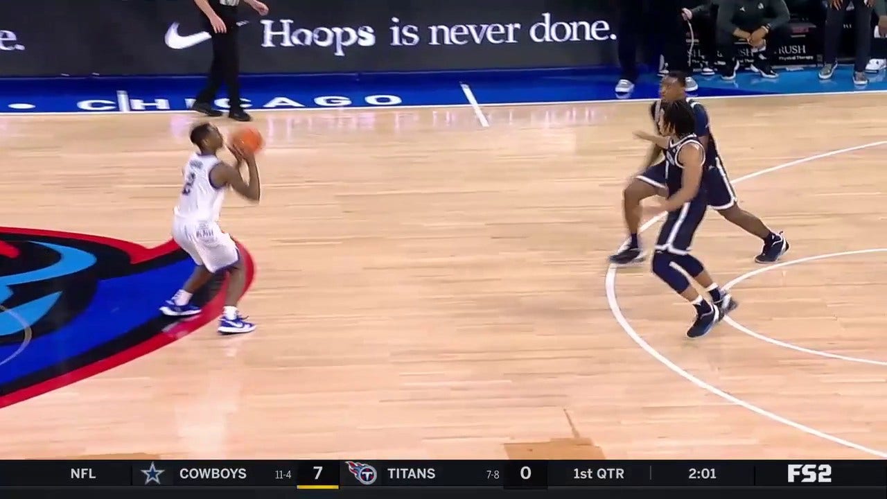 Umoja Gibson buries a three pointer from the logo to increase DePaul's lead over Georgetown at half