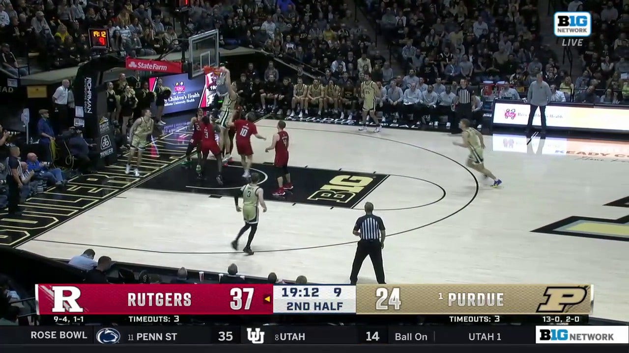 Zach Edey follows the miss with a putback dunk as Purdue tries to chip away at the deficit